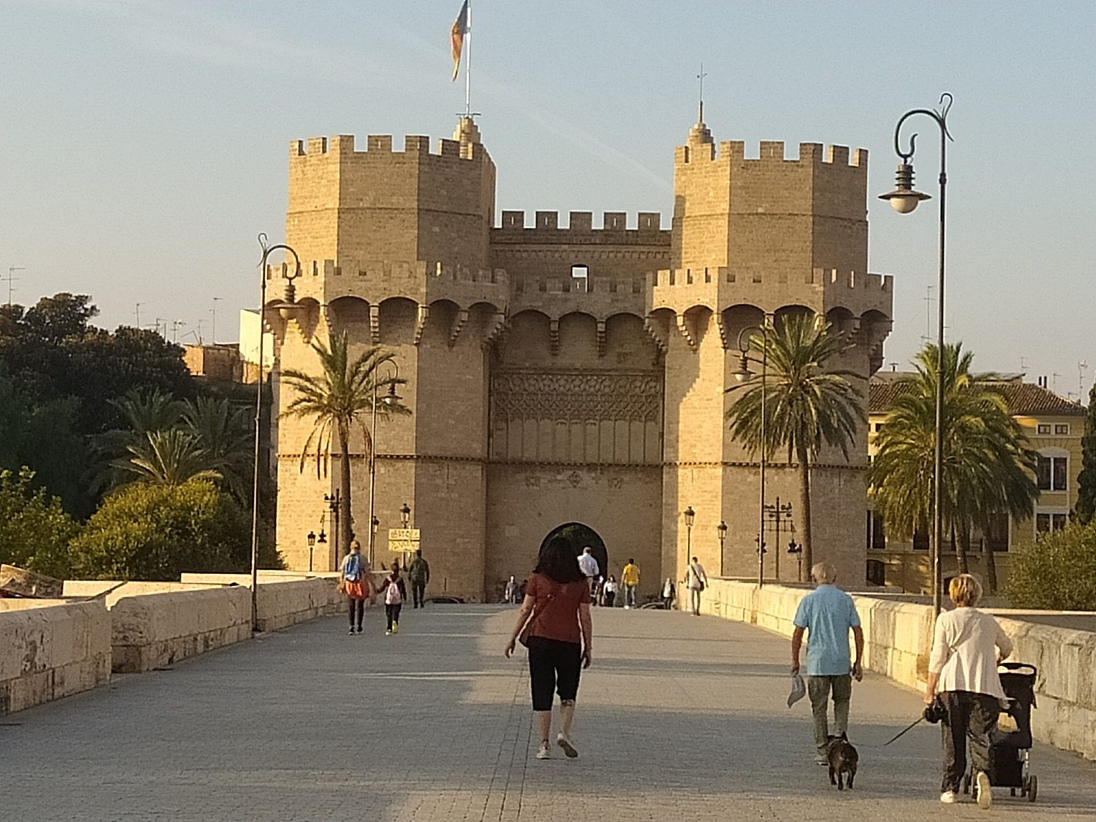 The Torres de Serranos gate glowing in golden light